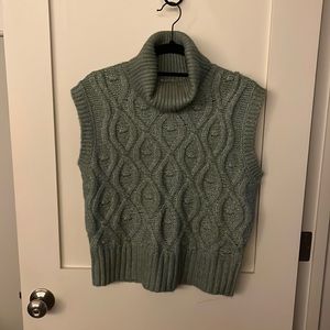 Sleeveless turtleneck sweater